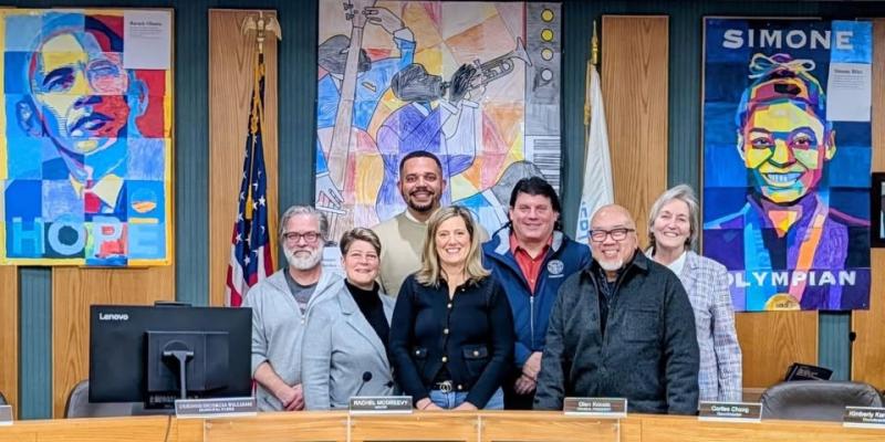 photo fo the members of the 2026 Governing Body in front of art created by Wilson students